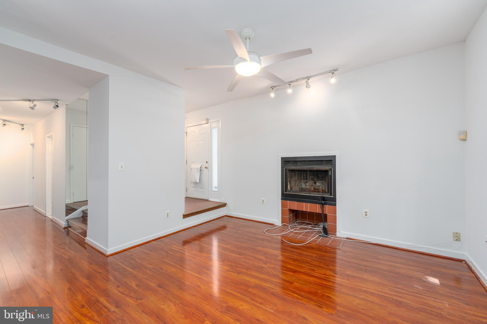 104 West Barre Street, Unit R 46 Baltimore, MD 21201 - Photo 3 of 18 Living Room with wood burning fireplace
