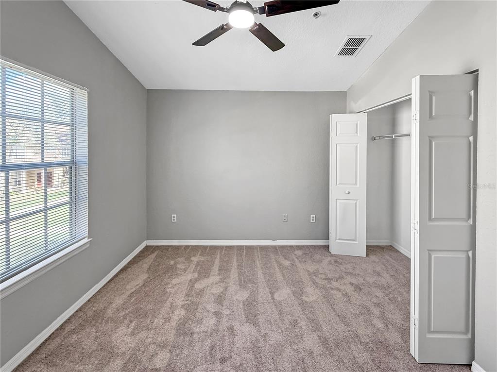 860 Grand Regency Pointe, Unit 200 Altamonte Springs, FL 32714 - Photo 12 of 23 a view of an empty room with a window