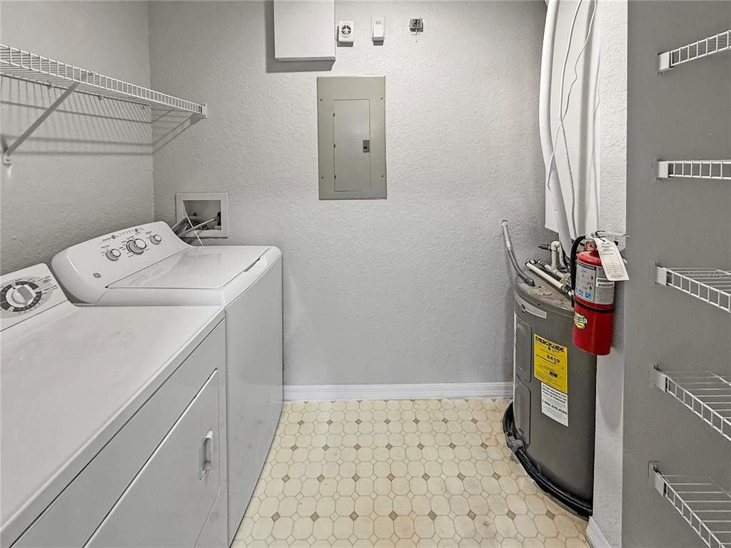 860 Grand Regency Pointe, Unit 200 Altamonte Springs, FL 32714 - Photo 14 of 23 a utility room with dryer and washer