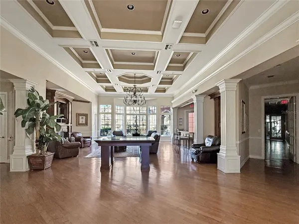 a view of a livingroom with furniture window and wooden floor
