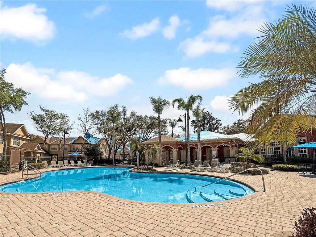 860 Grand Regency Pointe, Unit 200 Altamonte Springs, FL 32714 - Photo 21 of 23 a view of a swimming pool with a patio