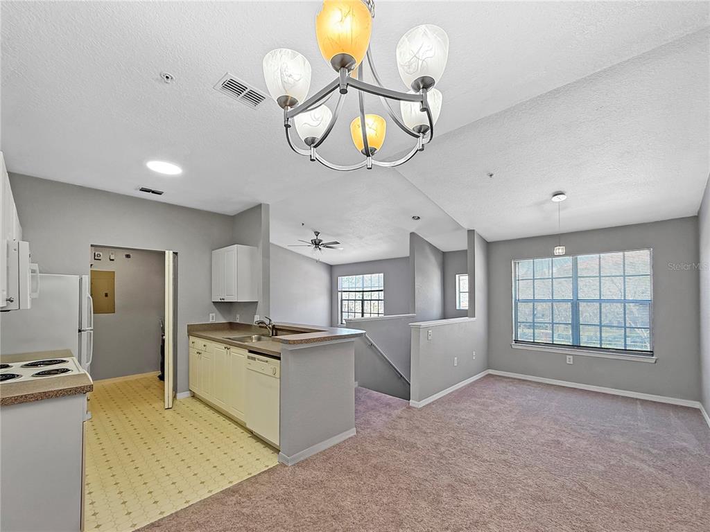 860 Grand Regency Pointe, Unit 200 Altamonte Springs, FL 32714 - Photo 3 of 23 a open kitchen with cabinets and stainless steel appliances