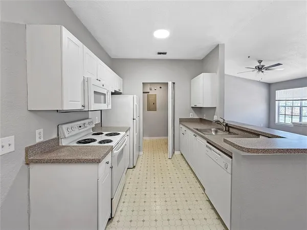 a kitchen with stainless steel appliances granite countertop a stove and a sink