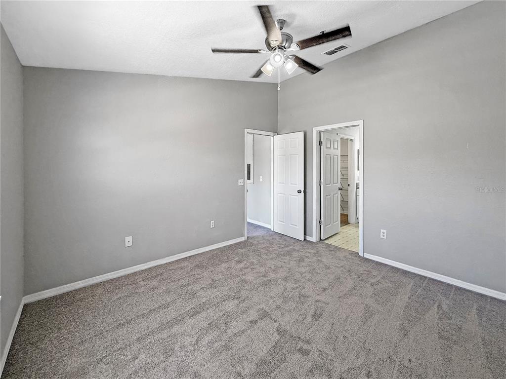 860 Grand Regency Pointe, Unit 200 Altamonte Springs, FL 32714 - Photo 7 of 23 en empty room with a fan and a fan