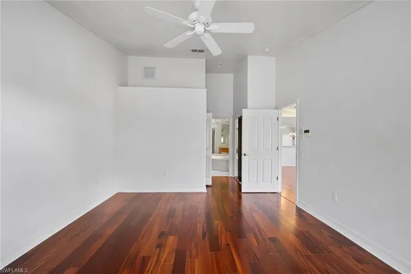 a spacious bathroom with a tub sink shower and mirror