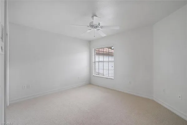 a view of a lake with houses in the back
