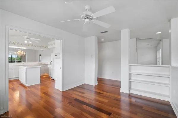 a view of kitchen with furniture and wooden floor