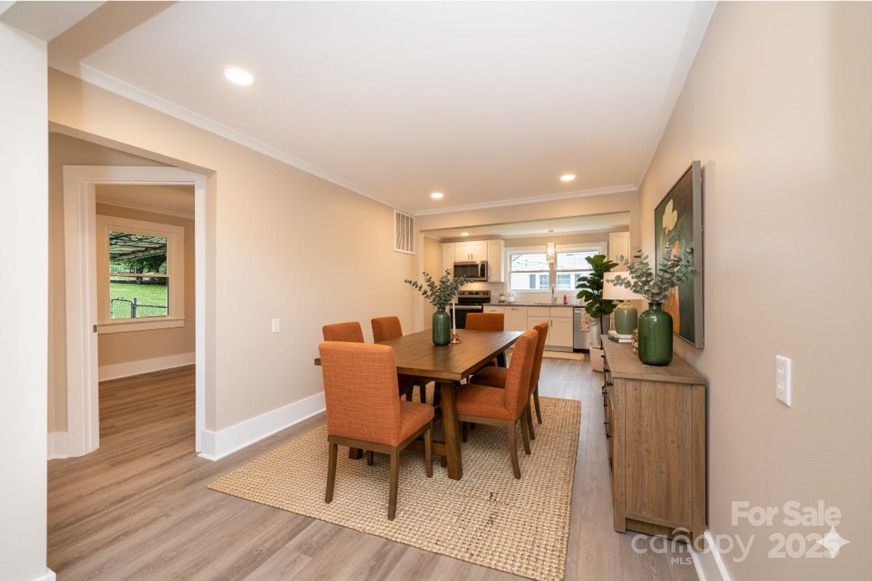 1105 Wildwood Road Lenoir, NC 28645 - Photo 12 of 38 a view of a dining room with furniture and wooden floor
