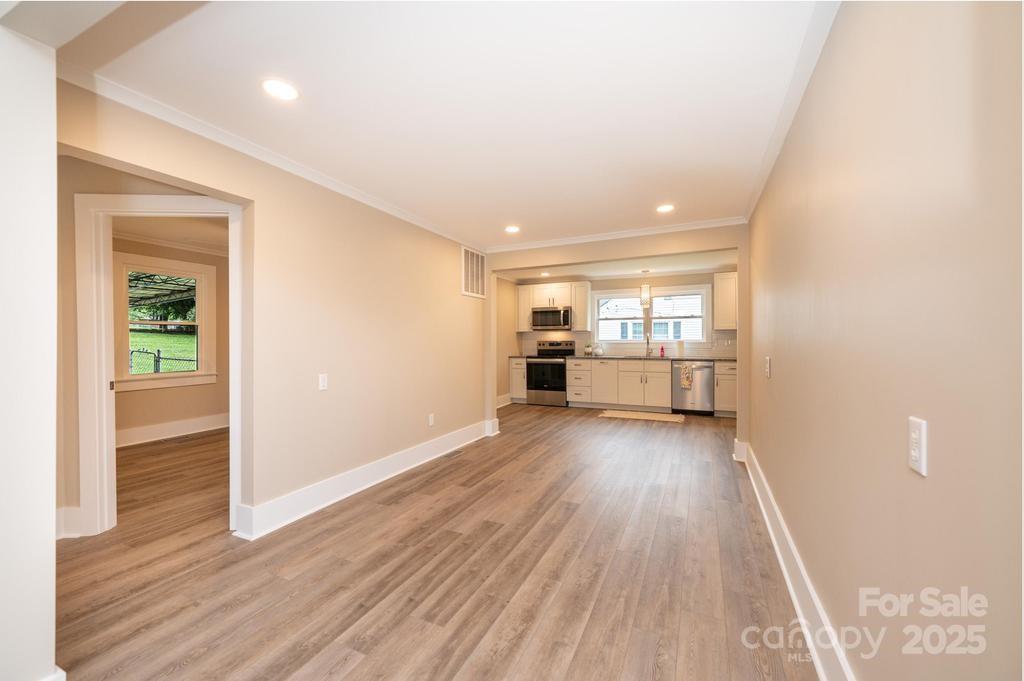 1105 Wildwood Road Lenoir, NC 28645 - Photo 13 of 38 wooden floor in an empty room with wooden floor
