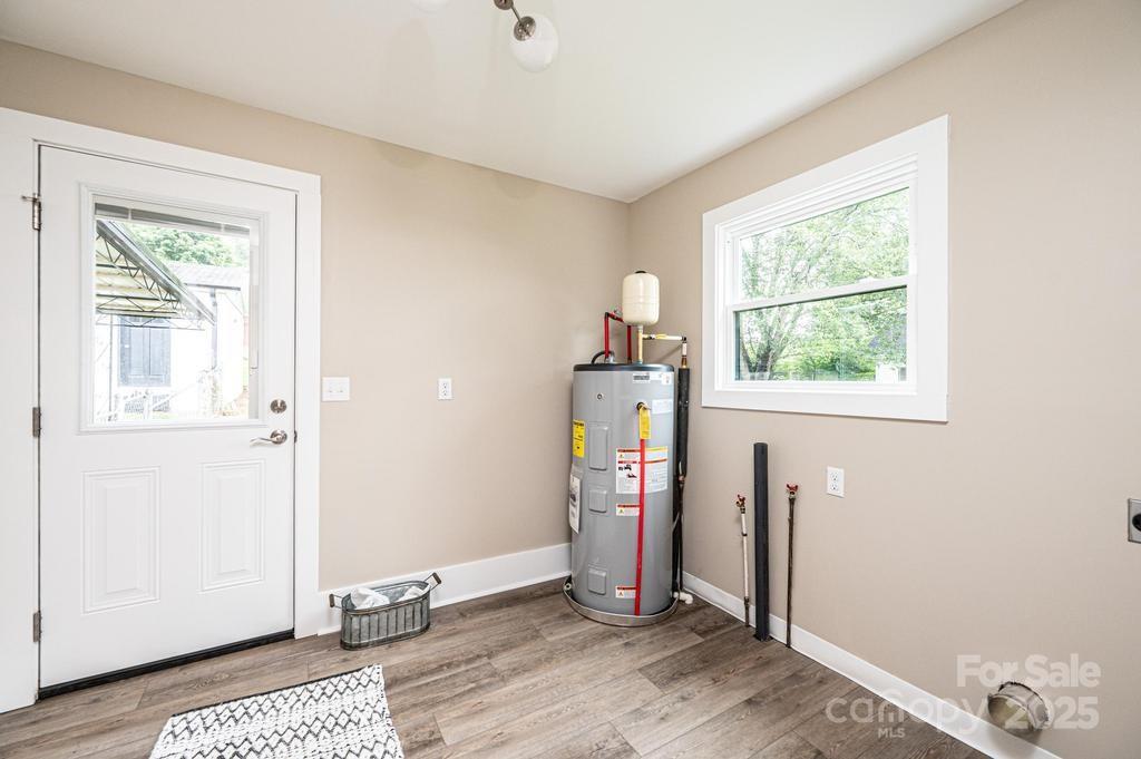 1105 Wildwood Road Lenoir, NC 28645 - Photo 18 of 38 a view of a room with gym equipment and wooden floor