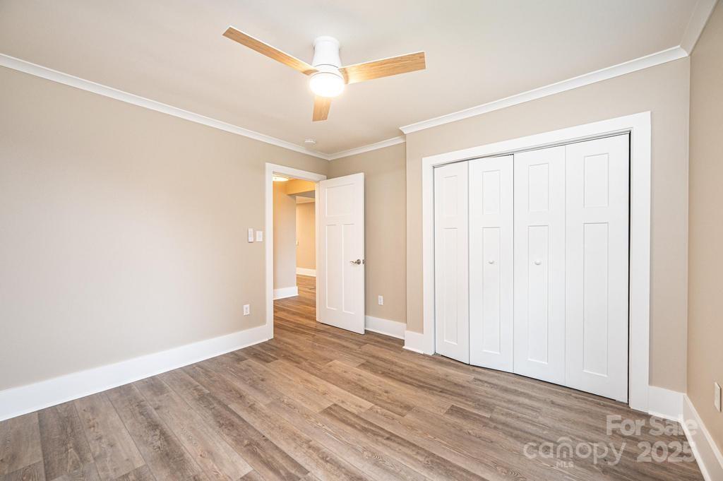 1105 Wildwood Road Lenoir, NC 28645 - Photo 21 of 38 an empty room with wooden floor and windows
