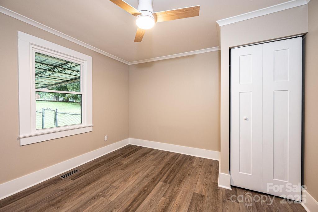 1105 Wildwood Road Lenoir, NC 28645 - Photo 28 of 38 an empty room with wooden floor and windows