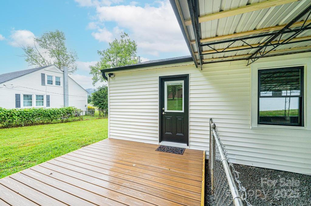 1105 Wildwood Road Lenoir, NC 28645 - Photo 29 of 38 a view of a house with a yard