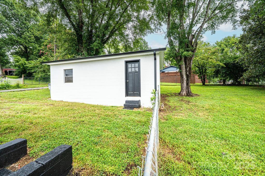 1105 Wildwood Road Lenoir, NC 28645 - Photo 31 of 38 a view of a backyard with a garden