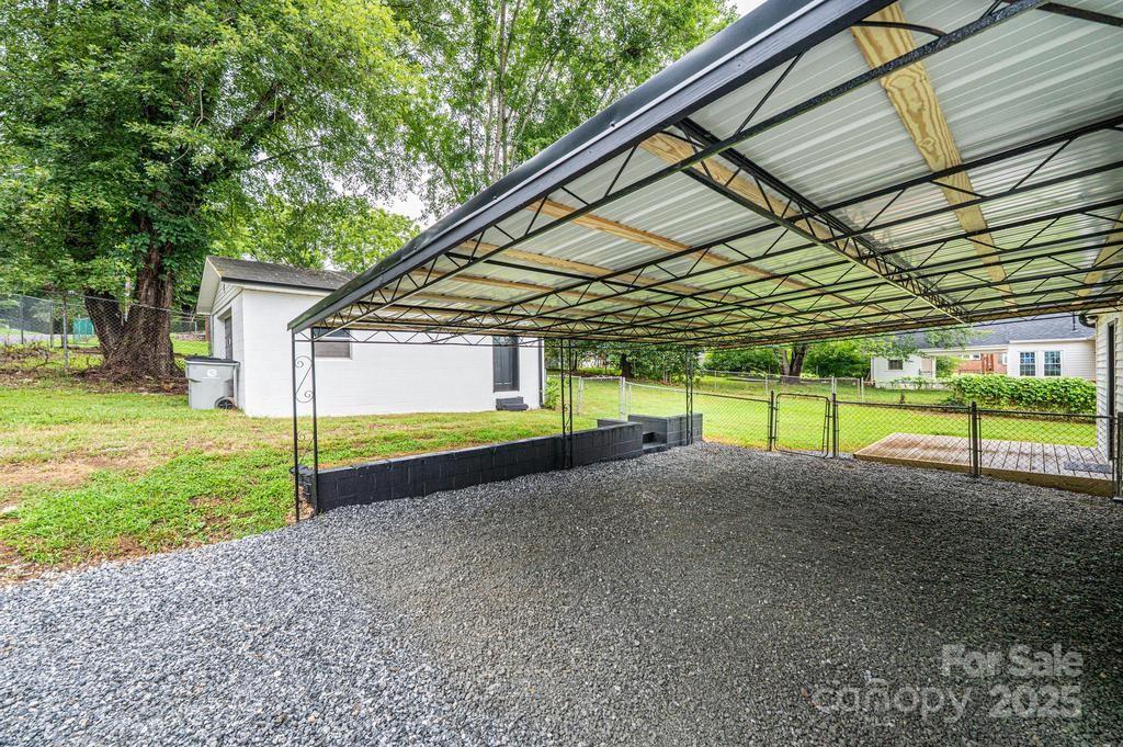 1105 Wildwood Road Lenoir, NC 28645 - Photo 36 of 38 a view of a house with a yard and sitting area