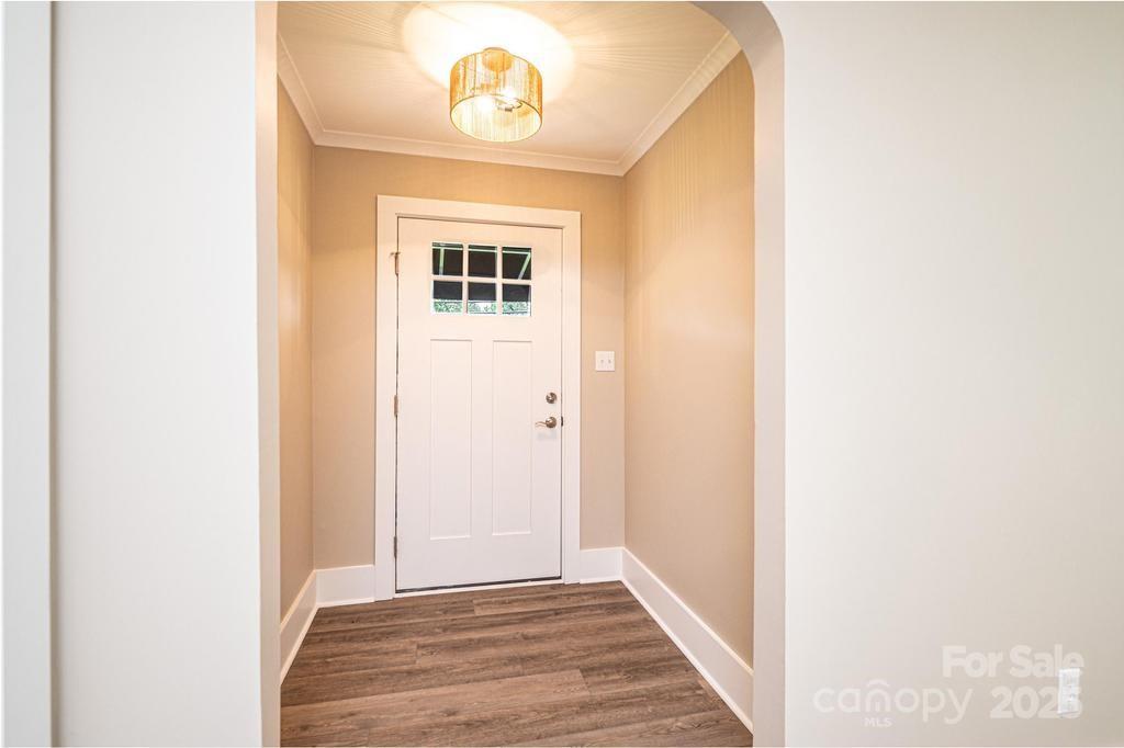 1105 Wildwood Road Lenoir, NC 28645 - Photo 6 of 38 a view of a hallway with wooden floor