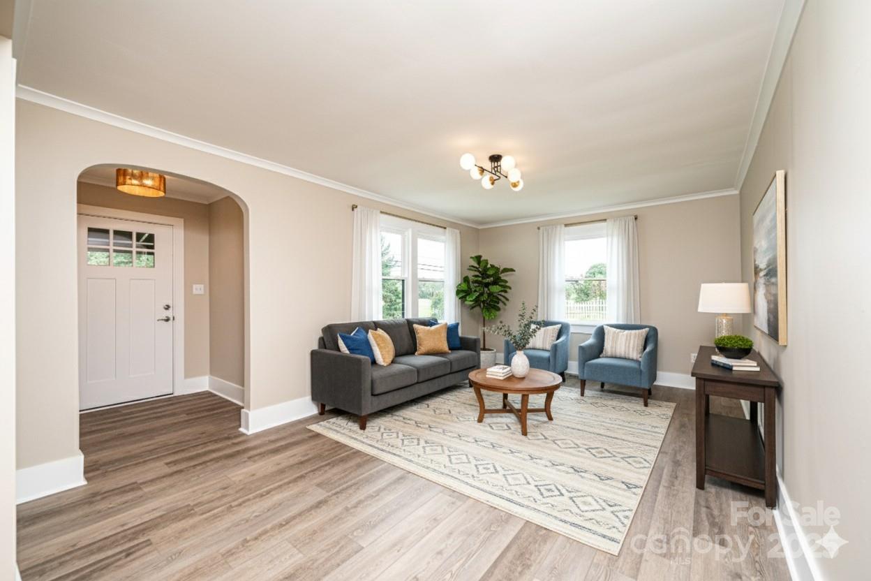 1105 Wildwood Road Lenoir, NC 28645 - Photo 7 of 38 a living room with furniture and wooden floor
