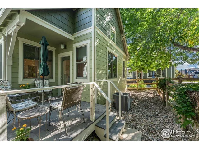 a view of a house with backyard porch and sitting area