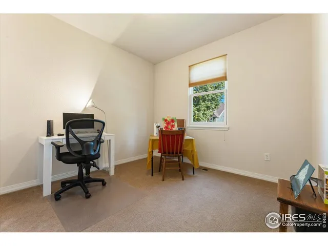 a workspace with furniture and a window