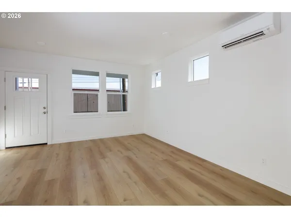 a view of an empty room with a window