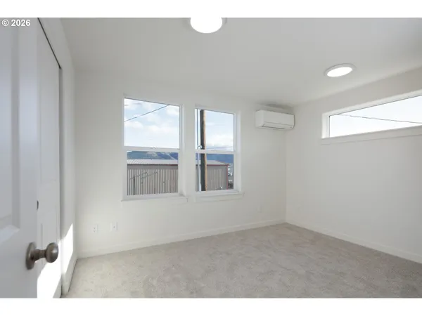 a view of an empty room with a window