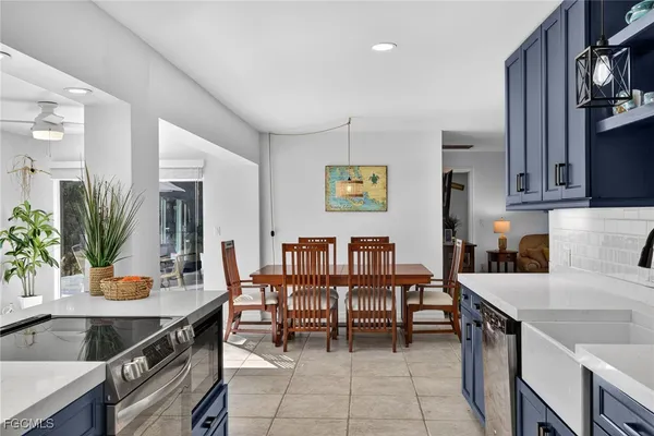 a kitchen with a table and chairs in it