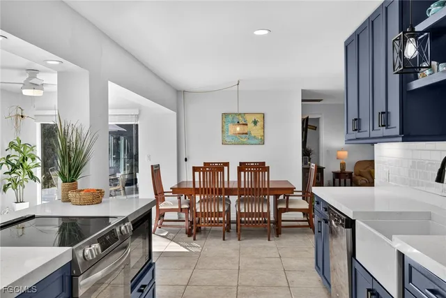 a kitchen with a table and chairs in it