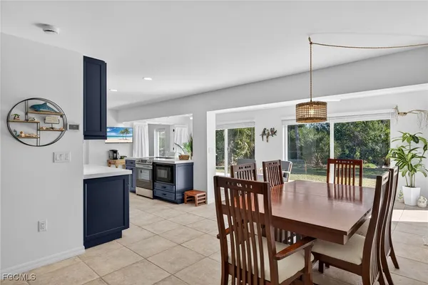 a dining room with furniture window and outdoor view