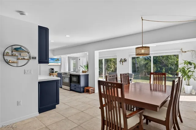 a dining room with furniture window and outdoor view