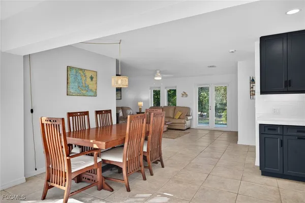 a view of a dining room with furniture and a fireplace