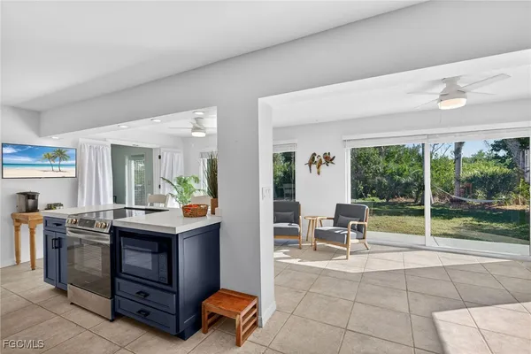 a view of kitchen with sink and window