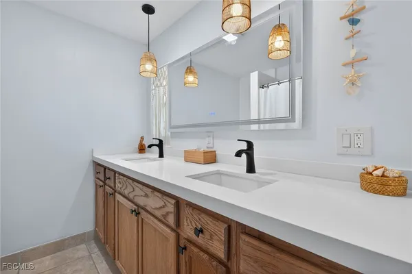 a kitchen with a sink cabinets and window