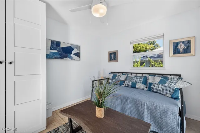 a view of a workspace with furniture and wooden floor