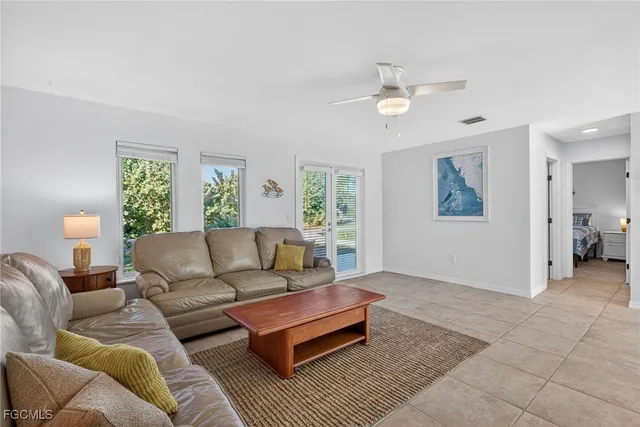 a living room with a couch and a window
