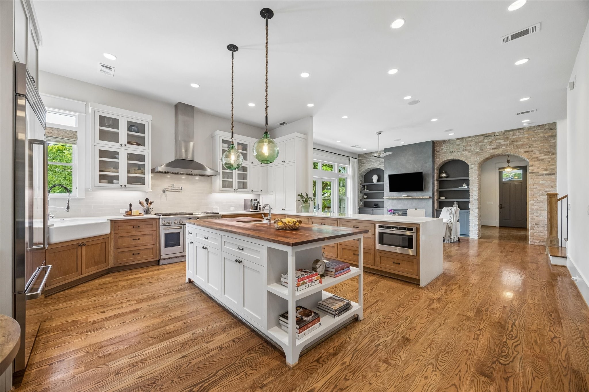 1101 Omar Street Houston, TX 77009 - Photo 12 of 46 The chef-designed kitchen features dual oversized islands overlooking the main living spaces, creating the ultimate setting for gathering, entertaining, and everyday family connection.