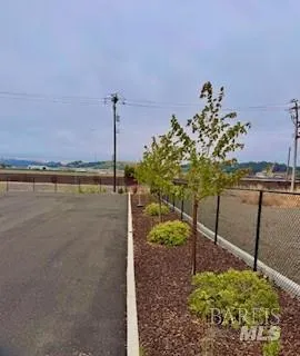 a view of a lake with a table and a chair