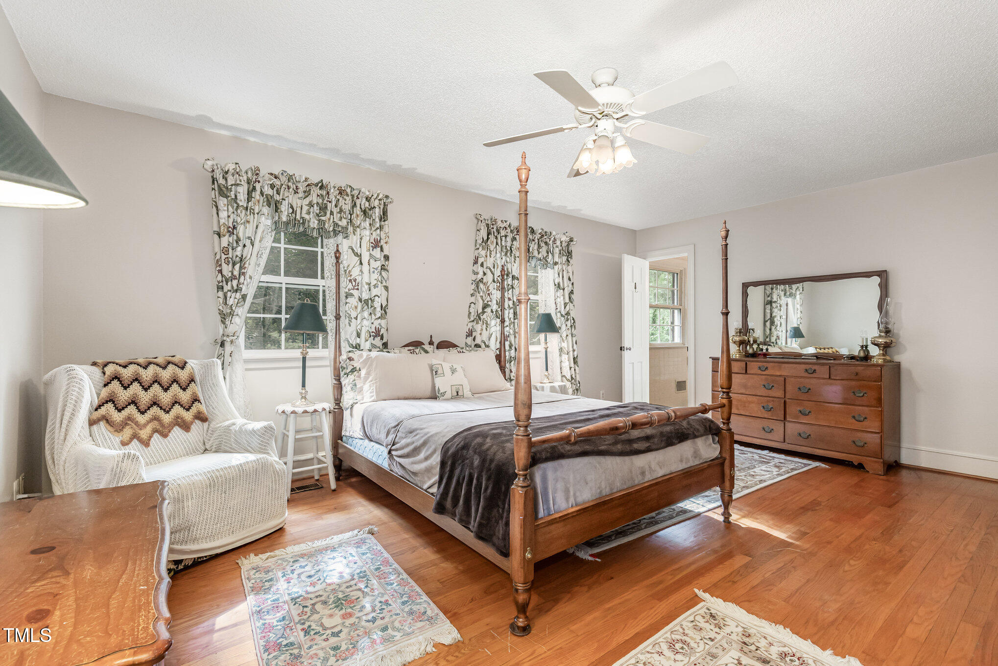 4113 Glen Laurel Drive Raleigh, NC 27612 - Photo 17 of 23 a bedroom with a large bed couch and a window