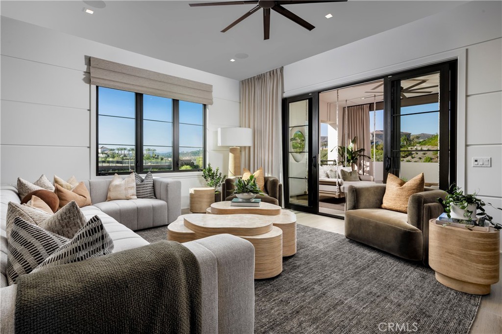 564 Peninsula Irvine, CA 92602 - Photo 17 of 20 a living room with furniture and a large window