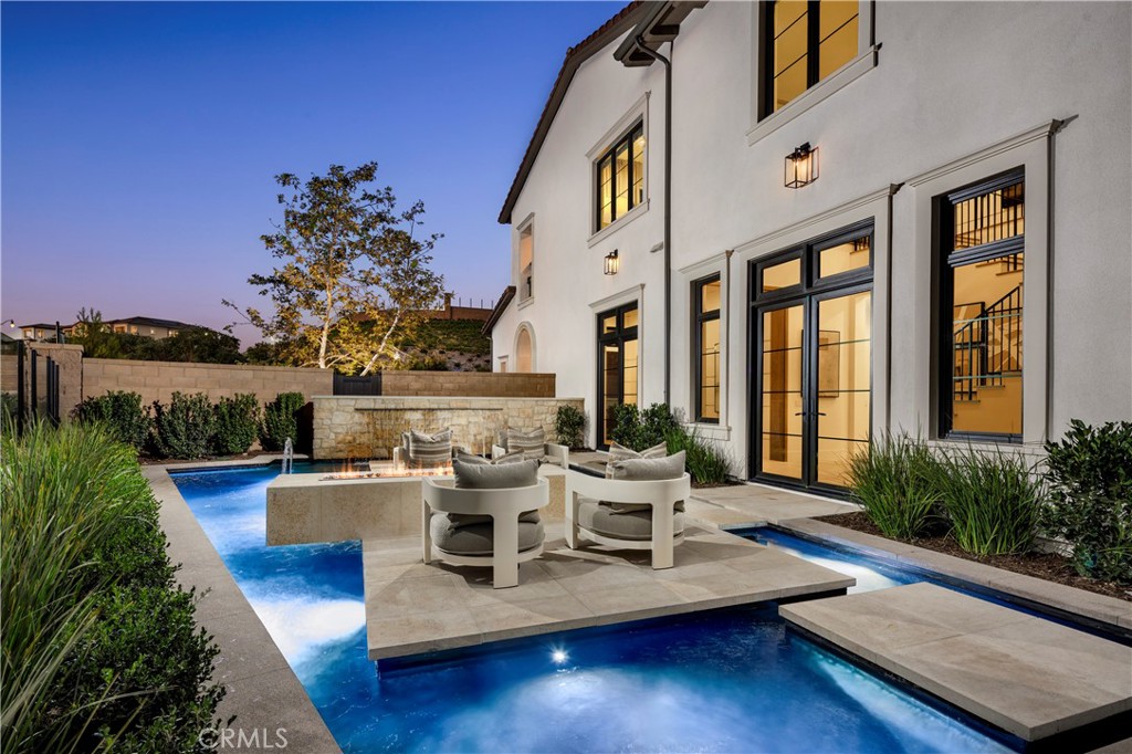 564 Peninsula Irvine, CA 92602 - Photo 5 of 20 a view of house with patio outdoor seating and covered with water view