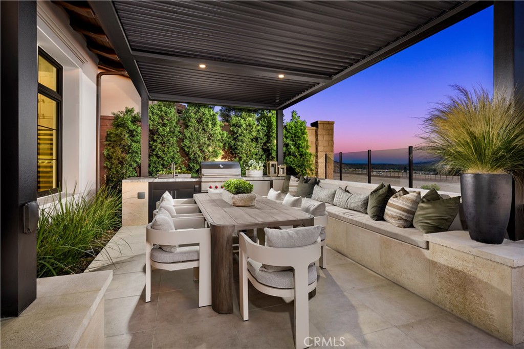 564 Peninsula Irvine, CA 92602 - Photo 6 of 20 a living room with patio furniture and a potted plants