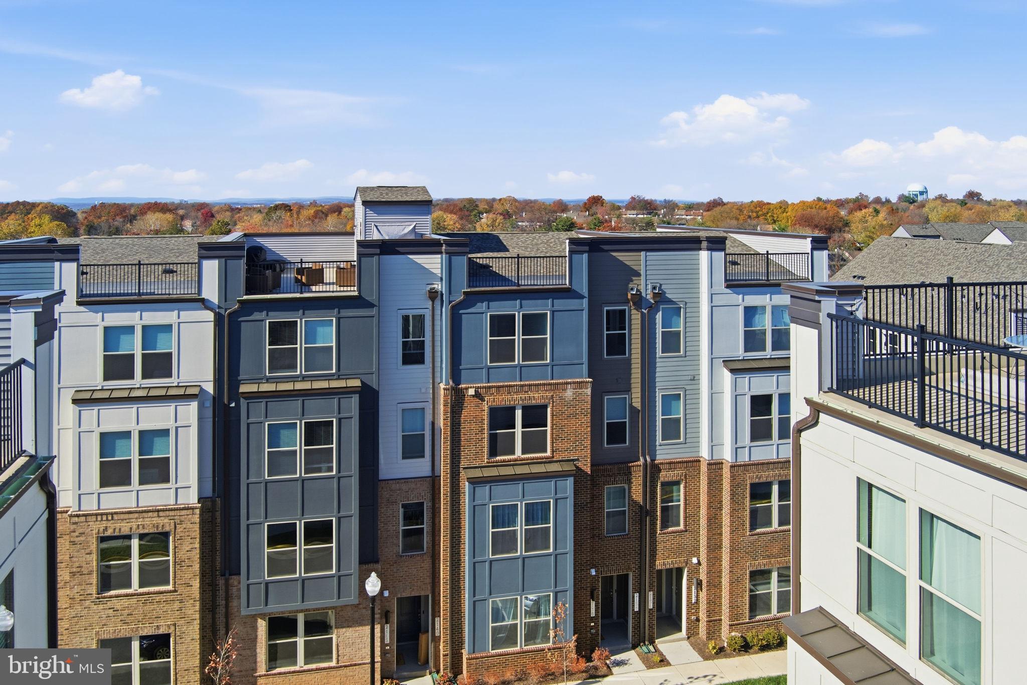 2136 Glacier Road Herndon, VA 20170 - Photo 1 of 79 a view of a city that has tall buildings