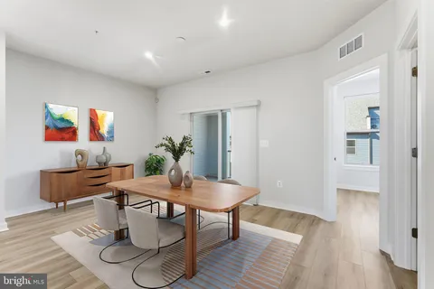 a view of wooden floor and windows in a room