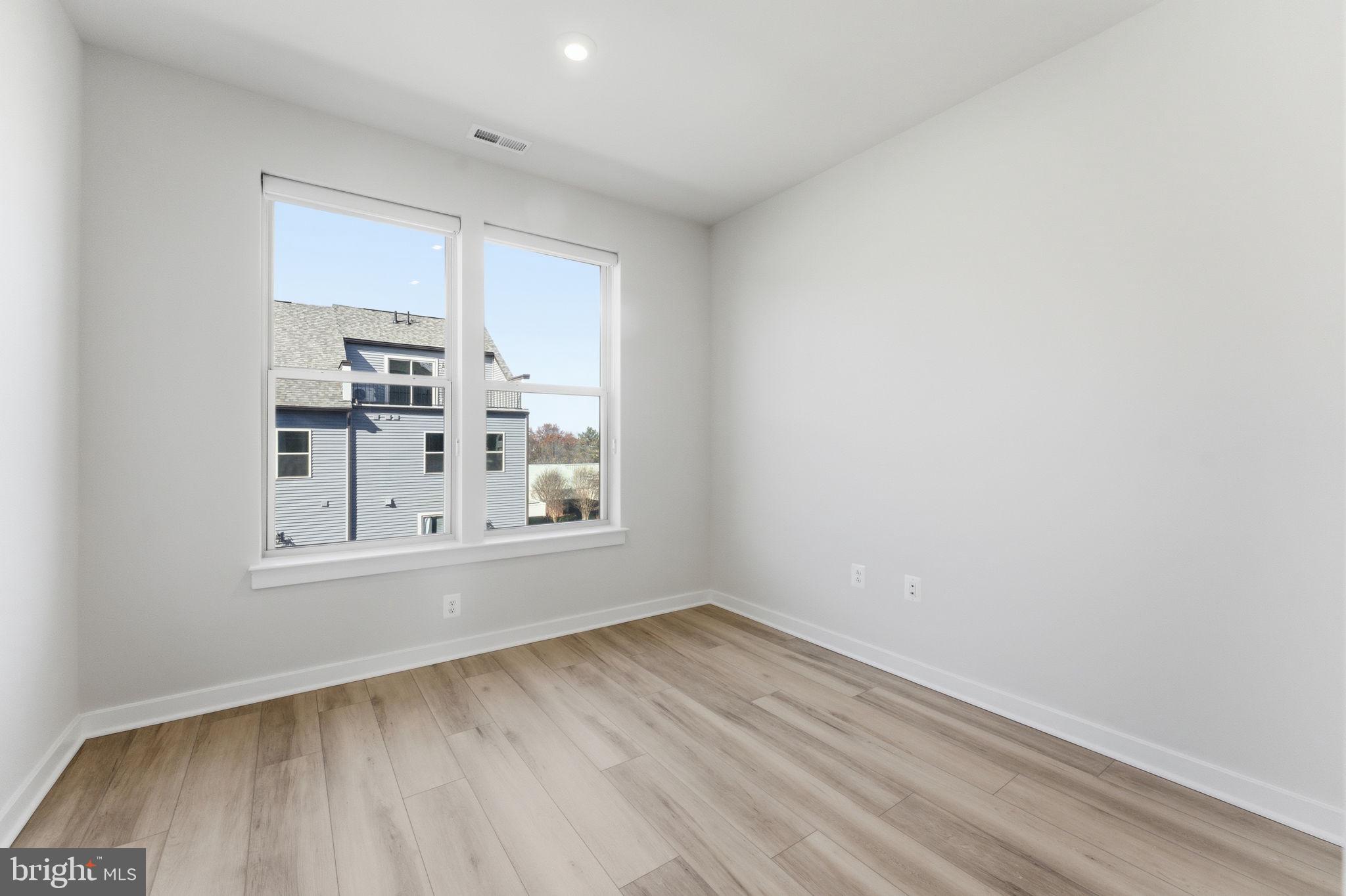 2136 Glacier Road Herndon, VA 20170 - Photo 14 of 79 a view of wooden floor and windows in a room