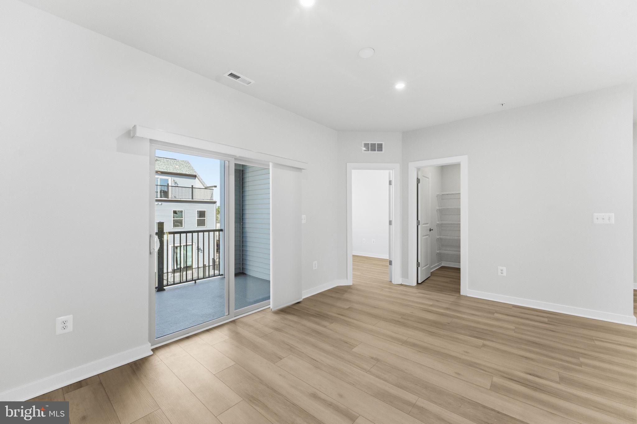 2136 Glacier Road Herndon, VA 20170 - Photo 14 of 79 wooden floor in an empty room with a window