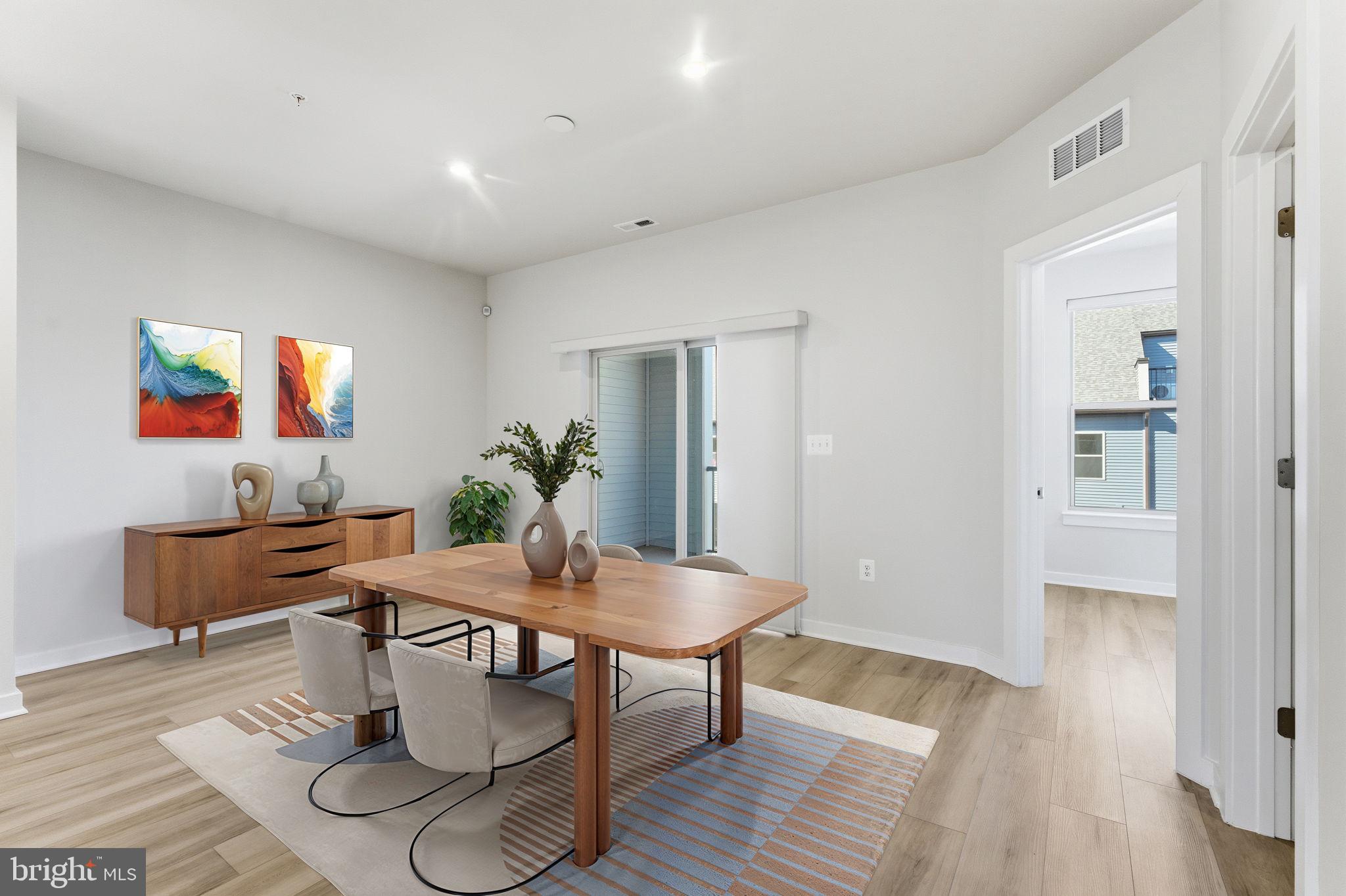 2136 Glacier Road Herndon, VA 20170 - Photo 16 of 79 a dining room with furniture and wooden floor