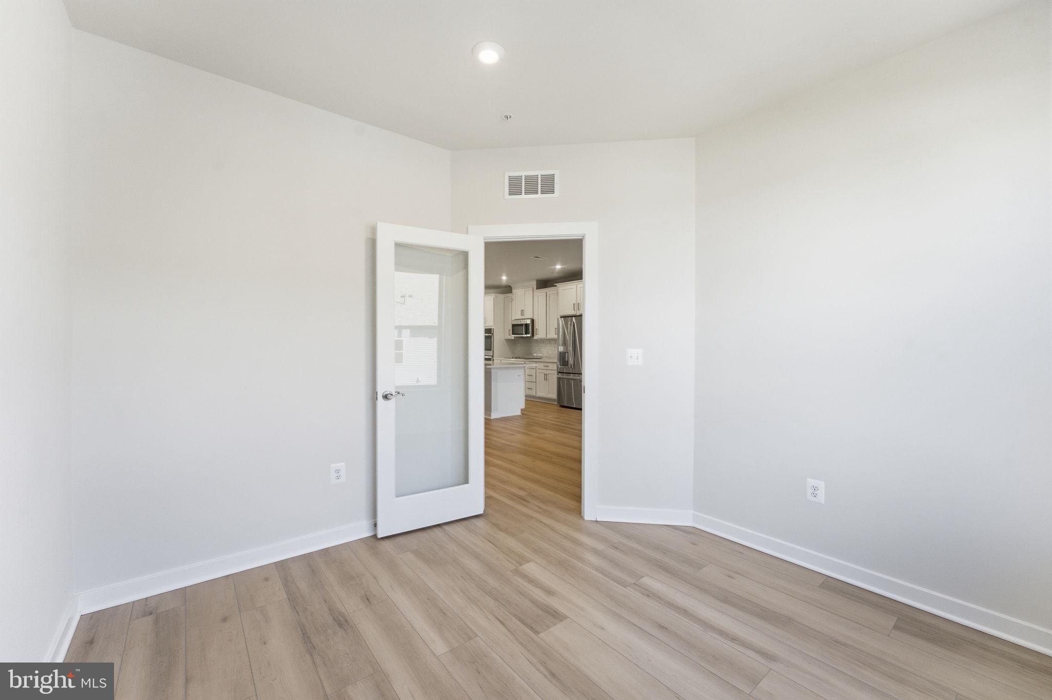 2136 Glacier Road Herndon, VA 20170 - Photo 17 of 79 a view of an empty room and wooden floor