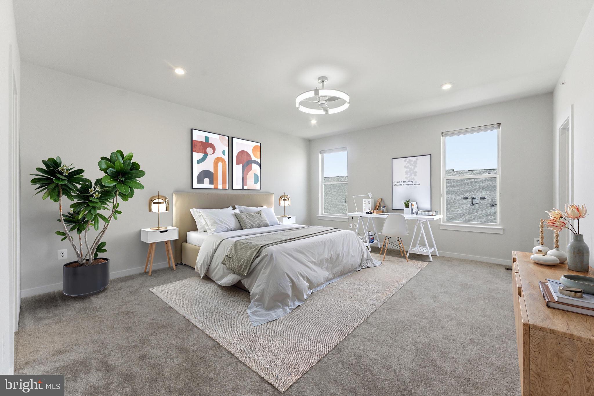 2136 Glacier Road Herndon, VA 20170 - Photo 21 of 79 a spacious bedroom with a bed and a couch