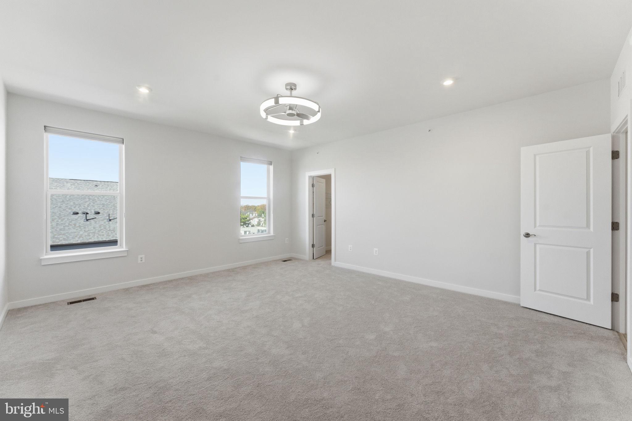 2136 Glacier Road Herndon, VA 20170 - Photo 23 of 79 an empty room with a window and a ceiling fan