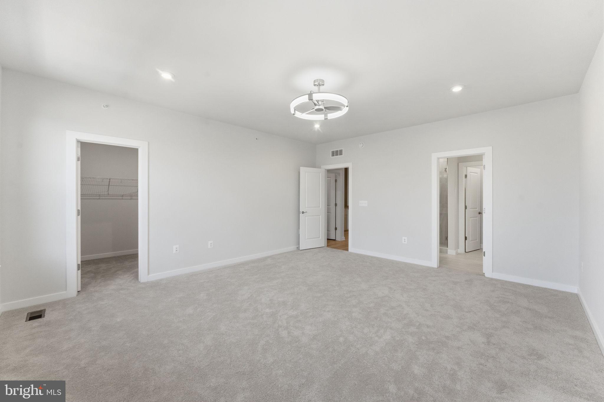 2136 Glacier Road Herndon, VA 20170 - Photo 24 of 79 an empty room with an entryway and closet area