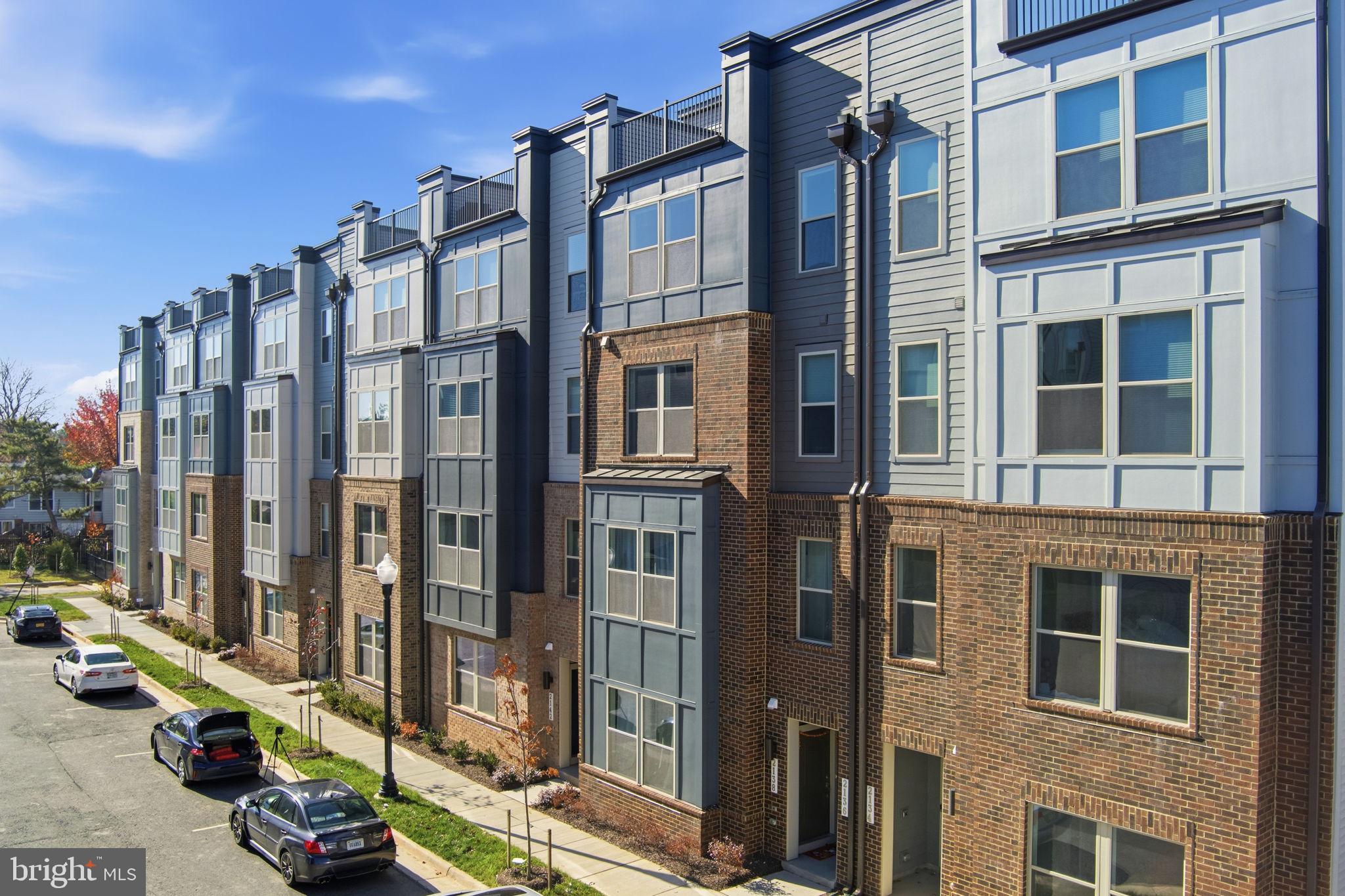 2136 Glacier Road Herndon, VA 20170 - Photo 41 of 79 a city street lined with tall buildings